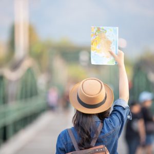 female-tourists-on-hand-have-a-happy-travel-map (1)